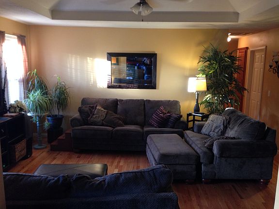 Living room comfortably holds Couch, Love Seat, Oversized Ch