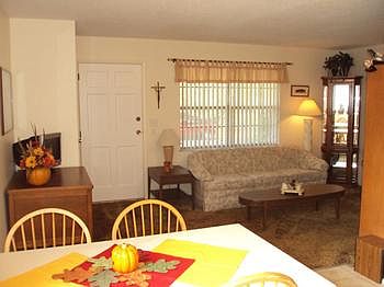 Living room open to the dining area.