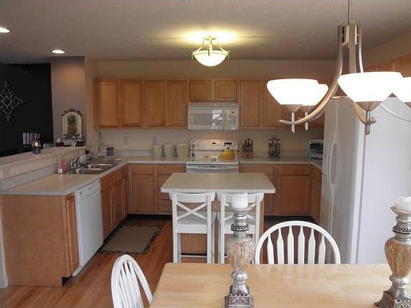 Upgraded cabinets, newer appliances, breakfast bar, island, and walk-in pantry