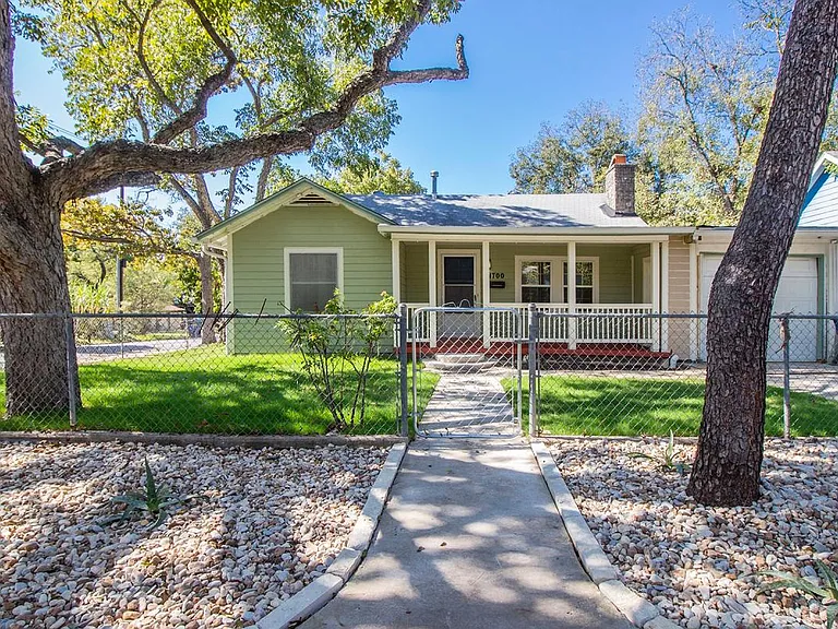 fully fenced all around on corner lot, plenty of parking for all!