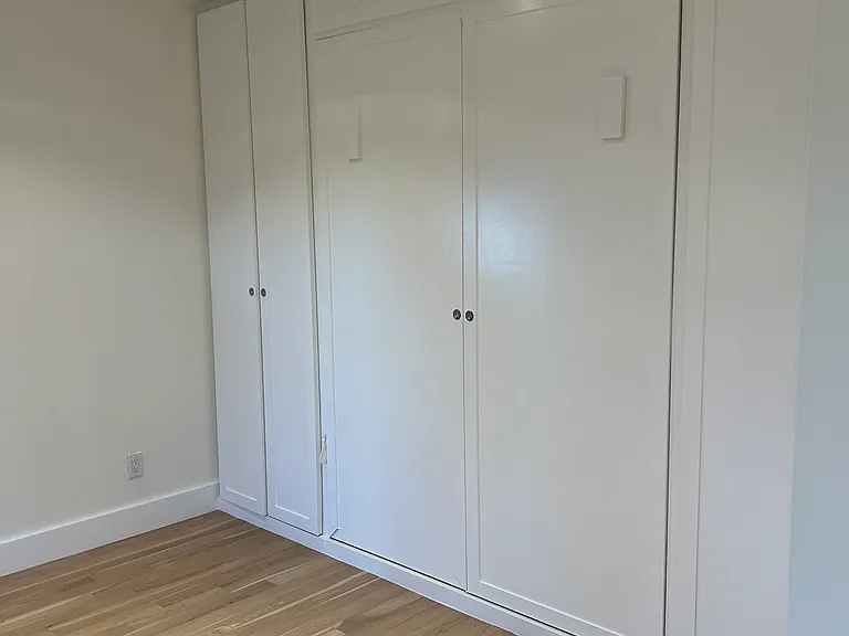 Large bedroom #2 (opposite end of hallway from primary) - Murphy bed and dual closets