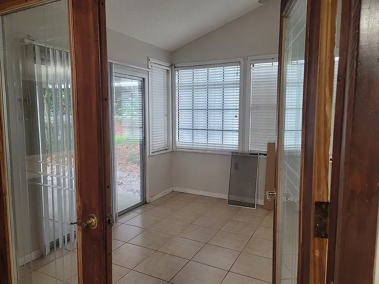 In Dining room looking into the sun room. This area is Not cooled.