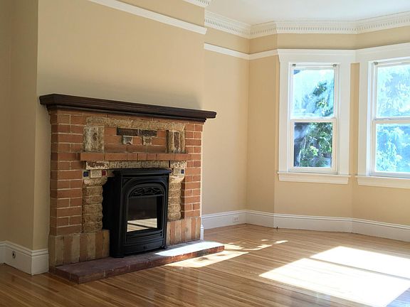 Newly-refinished quarter-sawn red/white oak hardwood floors, fresh paint throughout