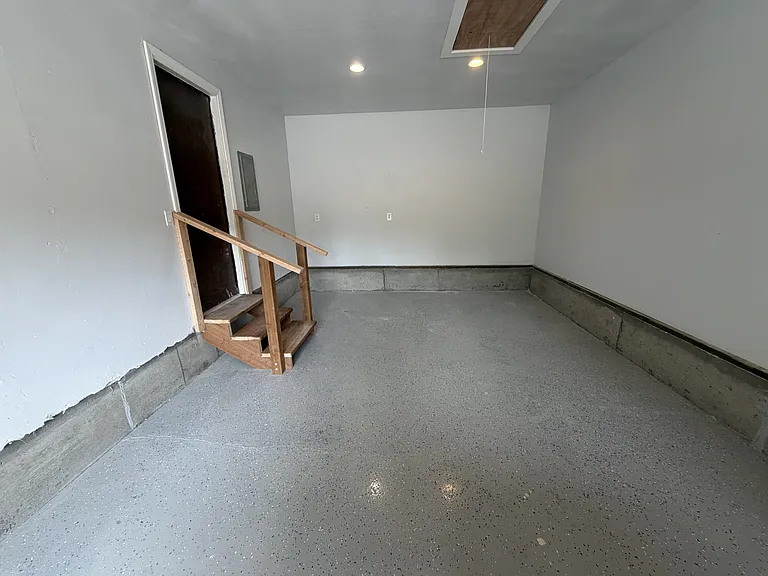 Garage, off the dining area. That door leads to the kitchen galley