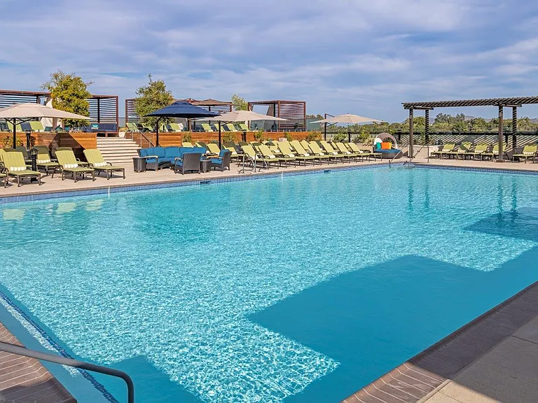 Outdoor rooftop pool for Life Time athletic resort members