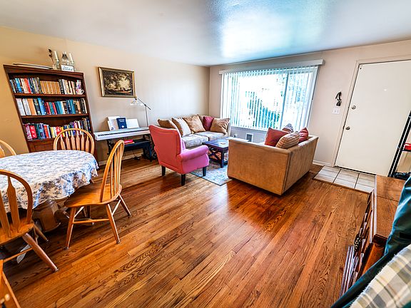 Huge living room with hardwood floor.
