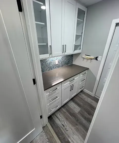 Garage entrance storage and staging area