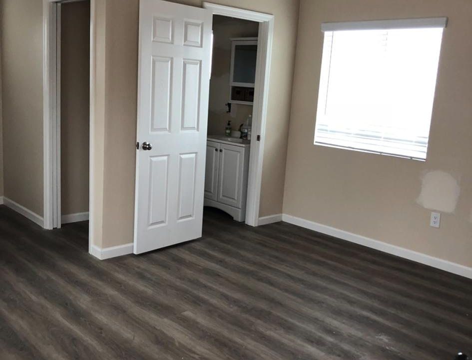 Main living area with high open beam ceiling