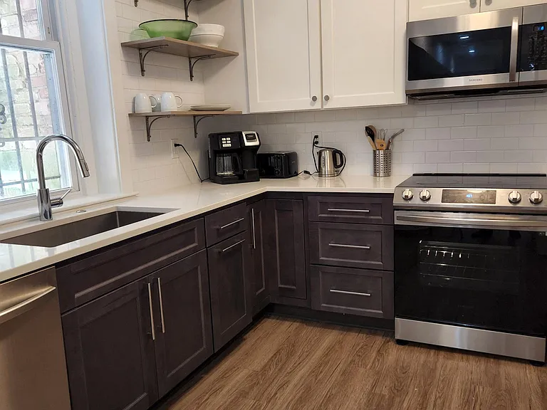 Large kitchen with lots of counter space, brand new smart samsung appliances and basic necessities for cooking.