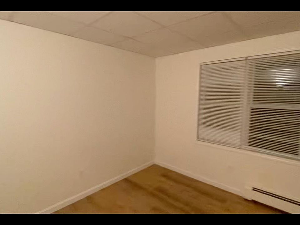 This shows the larger of the 2 bedrooms. It has a double window and a large closet (off screen on the right wall)