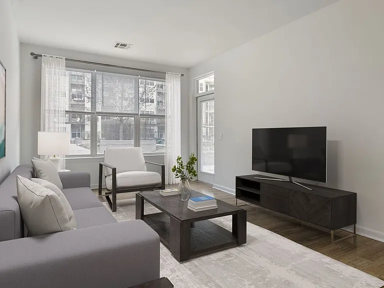 Renovated Package I living room with hard surface flooring