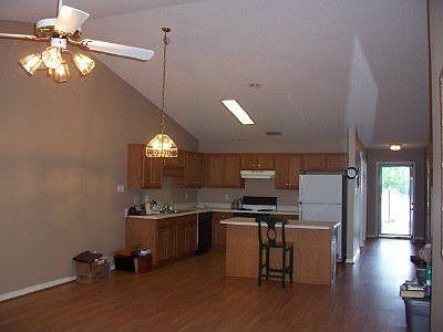 Open floor plan with cathedral ceiling.