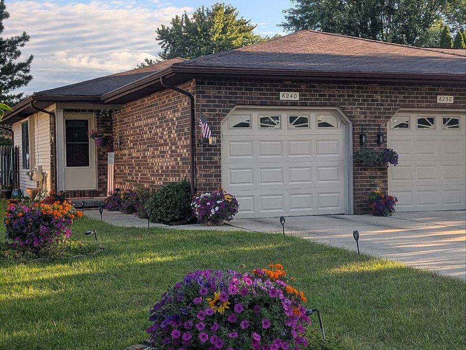 Front Entrance of our tastefully landscaped duplex home 6240 Weiss