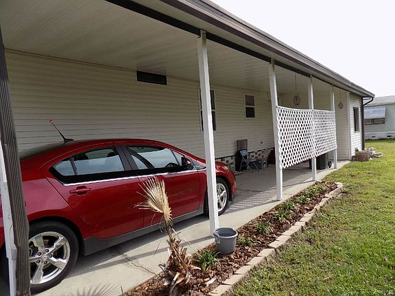 CARPORT / SIDE OF HOME