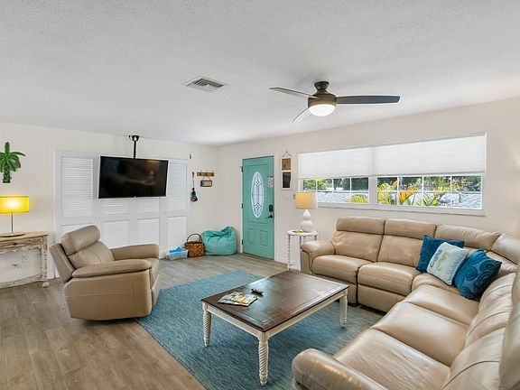 Bright, open living area with 55" Roku TV