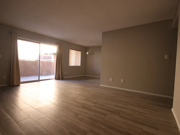 Your spacious living room, private balcony, and dining area. See a virtually-staged photo of your dining experience!