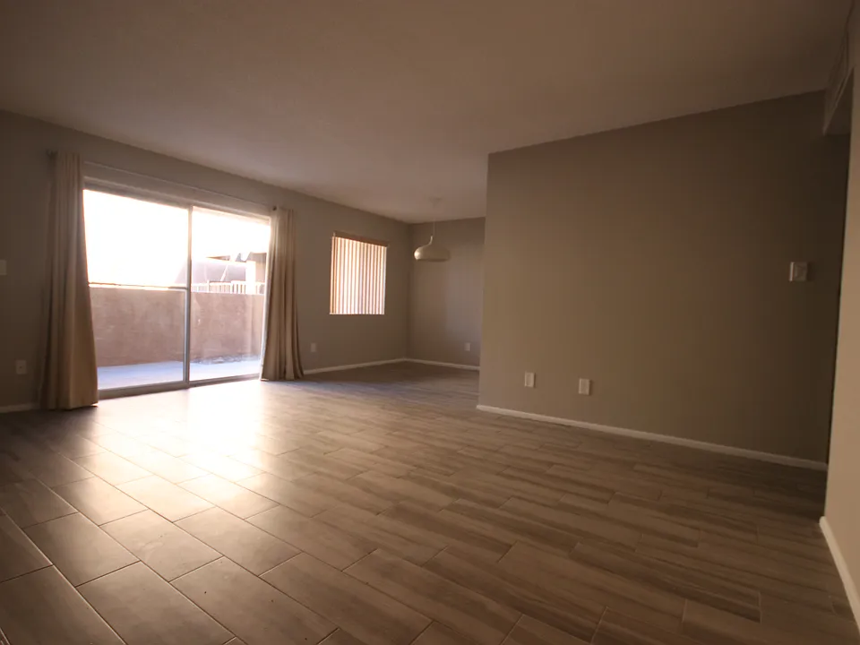 Your spacious living room, private balcony, and dining area. See a virtually-staged photo of your dining experience!