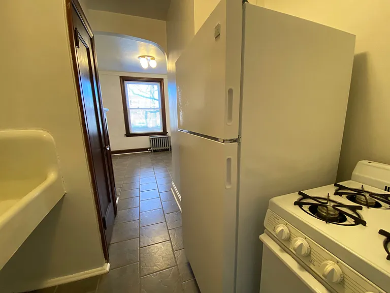 Large gas range and refrigerator included.
