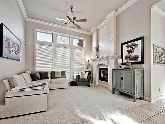 Second Living Room immediately off Front Entry with Pass-through Fireplace, Light Gray Walls and more Beautiful Light....