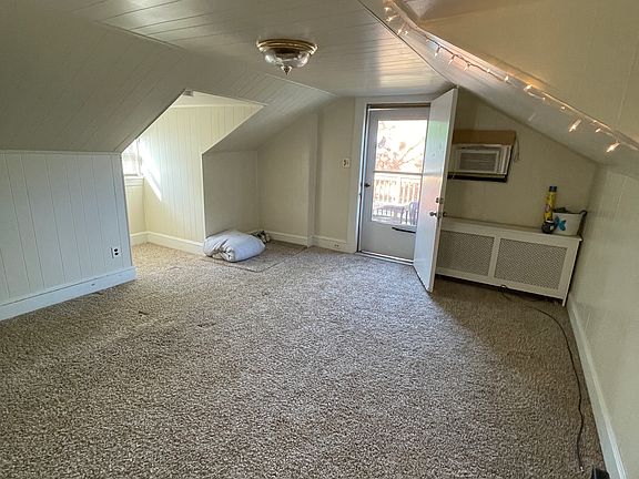 Living Room. Front door leading out to deck.
