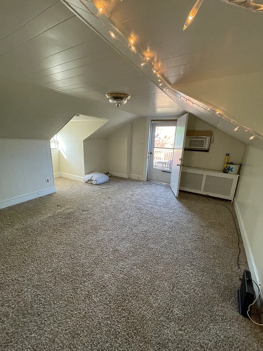 Living Room. Front door leading out to deck. - 3837 Garrett Rd #2