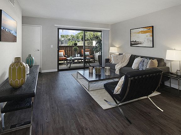 Living Room With Hardwood Style Floors and Outdoor Patio