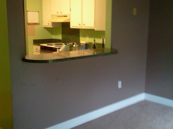 dining area connects to the kitchen and has a bar
