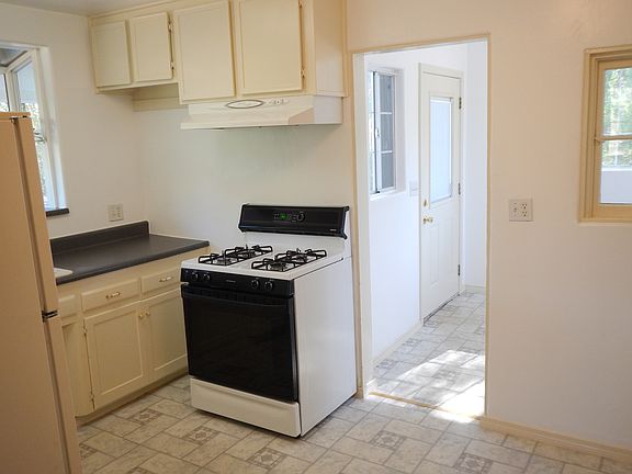 Kitchen with wash room beyond.