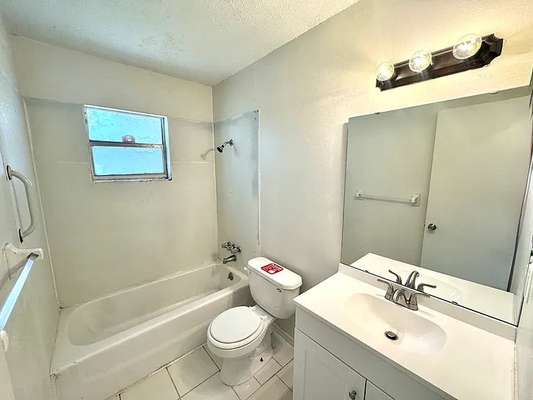 Interior photos are of a neighboring unit with identical floor plan. Paint color is the same, but the flooring is actually ceramic tile.