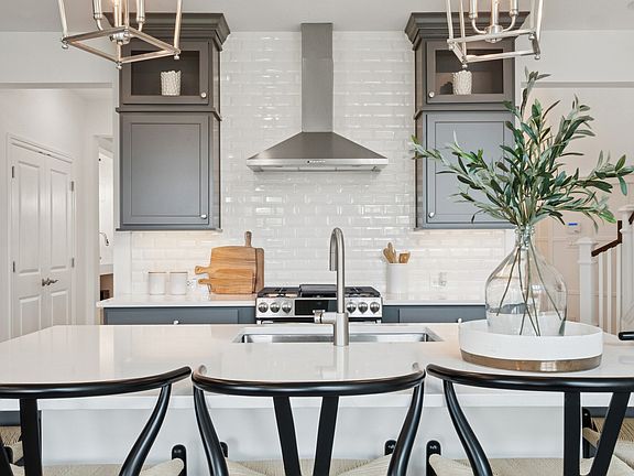 Kitchen with full-height tile backsplash