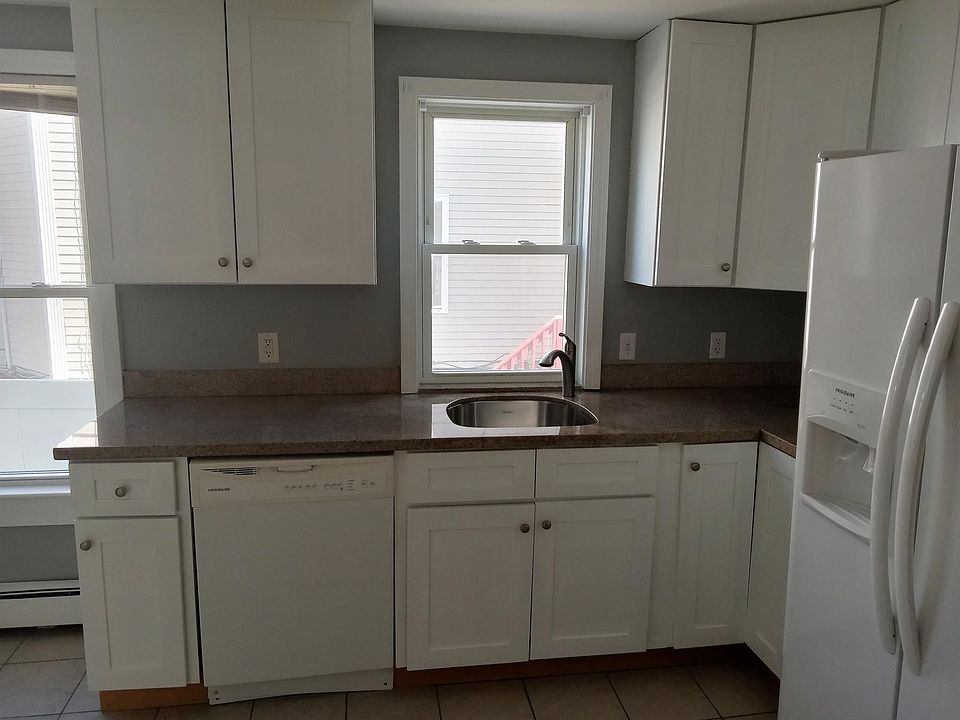 Eat-in Kitchen - sunny with lots of windows and light, solid wood white cabinets, granite countertops, ceramic tiled floor, all appliances