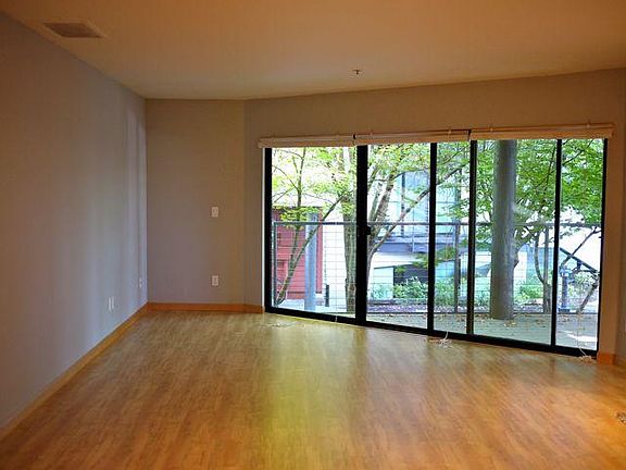 Brand-new maple hardwood floors are in the main living area.