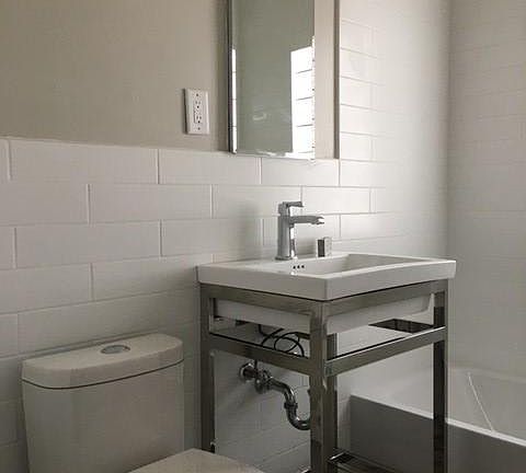 Fully renovated bathroom will new fixtures, subway tile and heated floors.