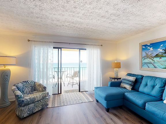 Living room w/ balcony view