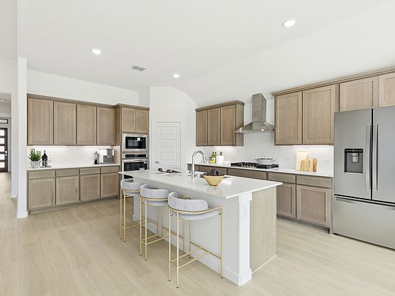 Kitchen in the Gilmour II home plan by Trophy Signature Homes - REPRESENTATIVE PHOTO