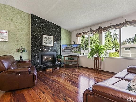 Gas marble fireplace on both floors of home. Home has Brazillian hardwood flooring. 