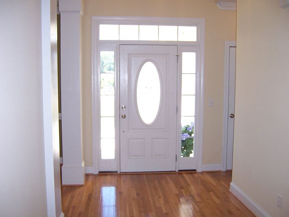 Impressive Foyer with Columns and Cathedral Ceiling