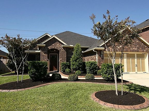 This stand-out home is the gem of the street with beautifully maintained lawn, fresh mulch and unique stone around the flower beds.