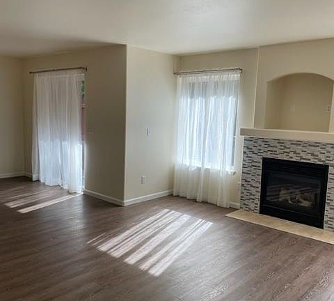 Living room view of dining area and sliding glass door to backyard large deck.