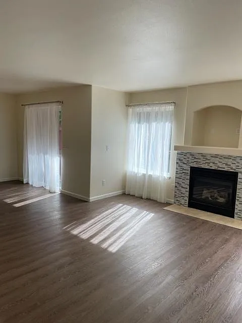 Living room view of dining area and sliding glass door to backyard large deck. - 2432 Hillbrook Cir