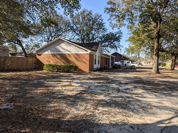 Large corner lot with lots of space in front yard, as well as the back yard. New gates and fence on both sides of the house.