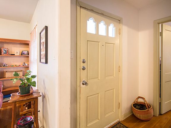 Front Entry. Door to 1st bedroom in background