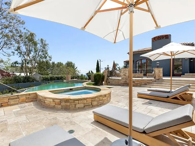 Spa and heated pool, surrounded with ample seating.