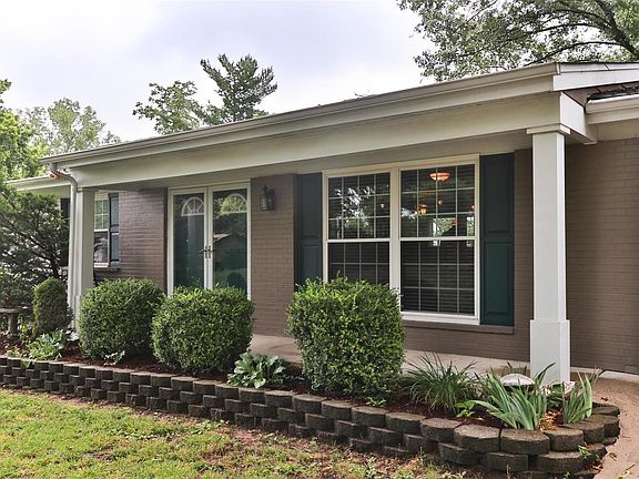 Charming curb appeal and covered front porch welcomes you inside