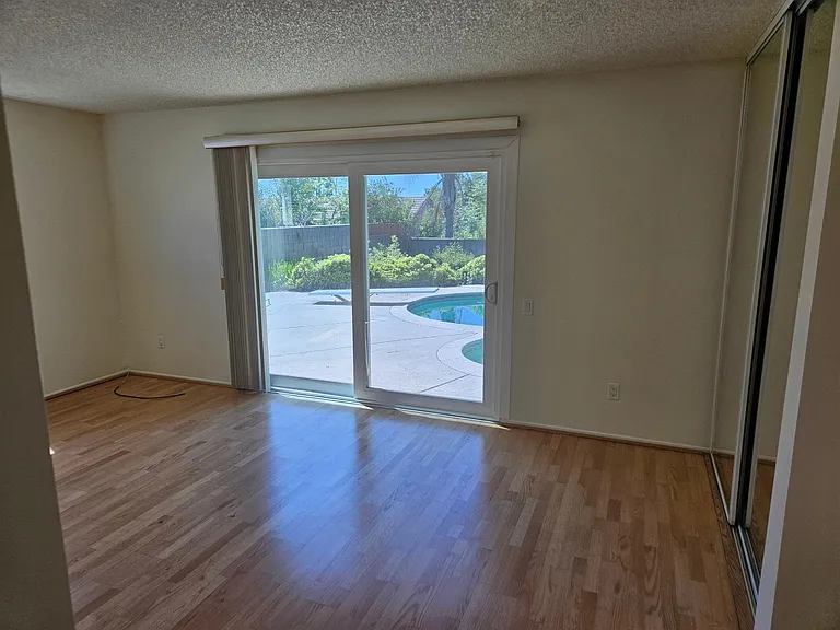 master suite with pool view