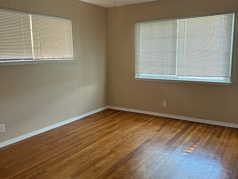 Master Bedroom - new paint, ceiling fan, and hardwood flooring.