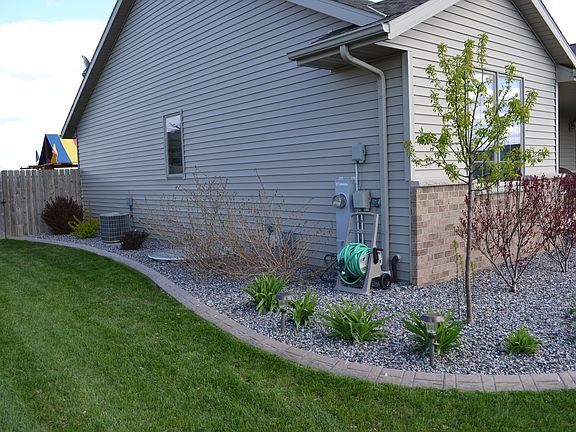Front Side Yard with Egress exit