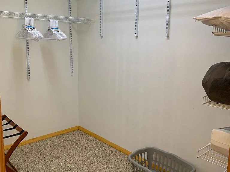 Large walk-in closet with plenty of space to stay organized. We include laundry basket, hangers, and extra pillows.