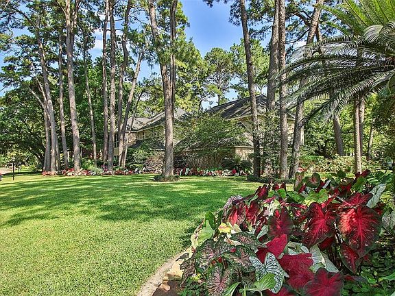 This home is fondly known as the "Caladium House." In the spring these gorgeous plants are cultivated by the seller to come up every year. The property comes equipped with a 12 zone sprinkler system to keep things lush and blooming. Grouped together 