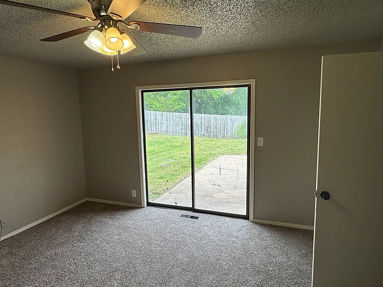 Master BR with sliding doors to patio, new carpet.